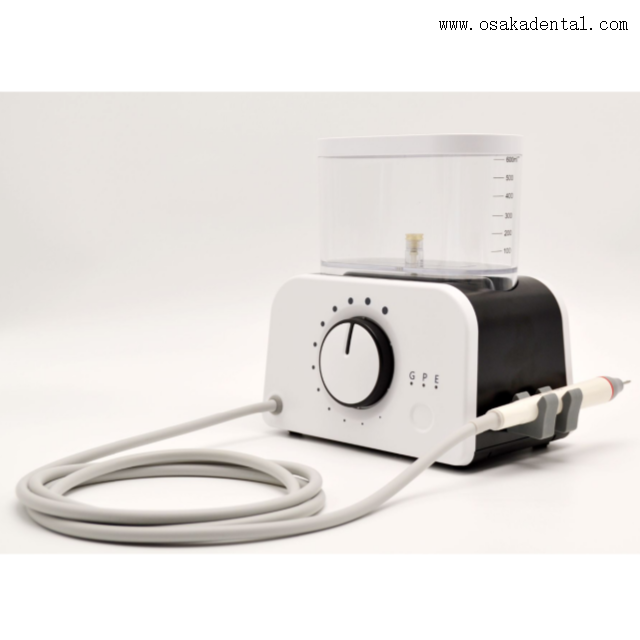 Détartreur dentaire avec pièce à main et bouteille à LED